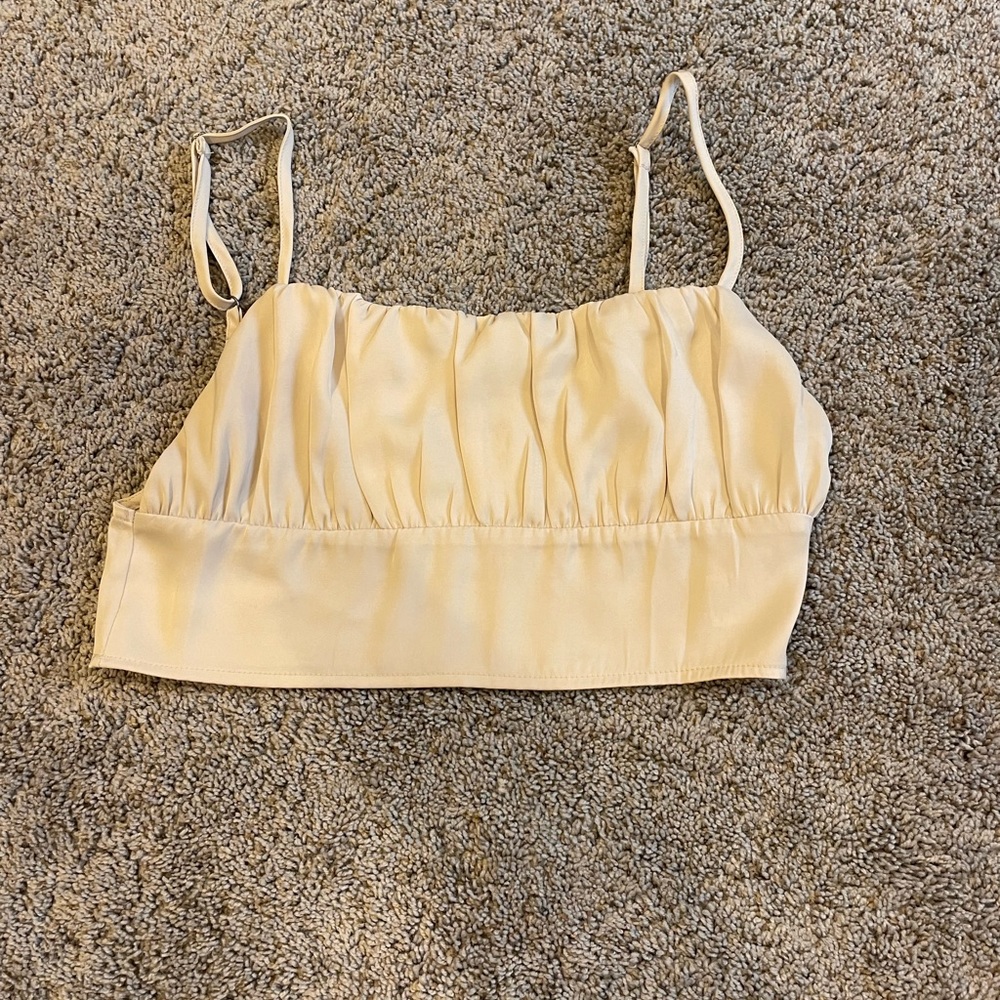 Pacsun’s “Kendall and Kylie” collection nude cropped silk top. Size S. NEW.